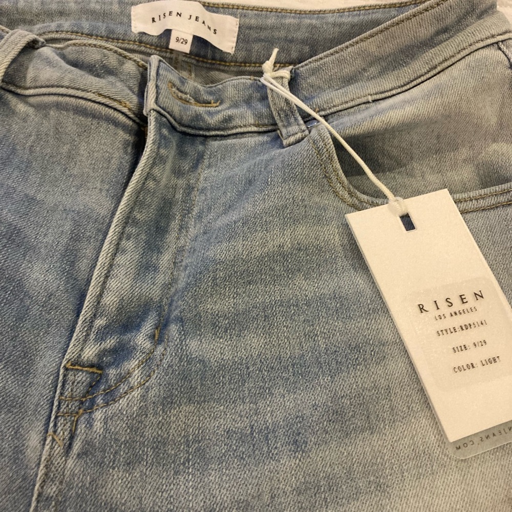 Beautiful Flare jeans with a white patter at bottom. Very stretchy.